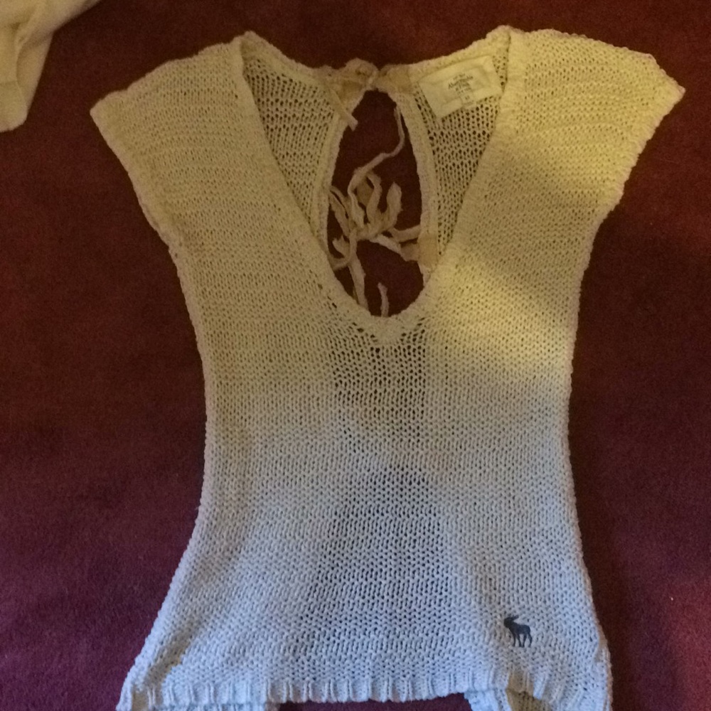 Woven cream colored open bank shirt.